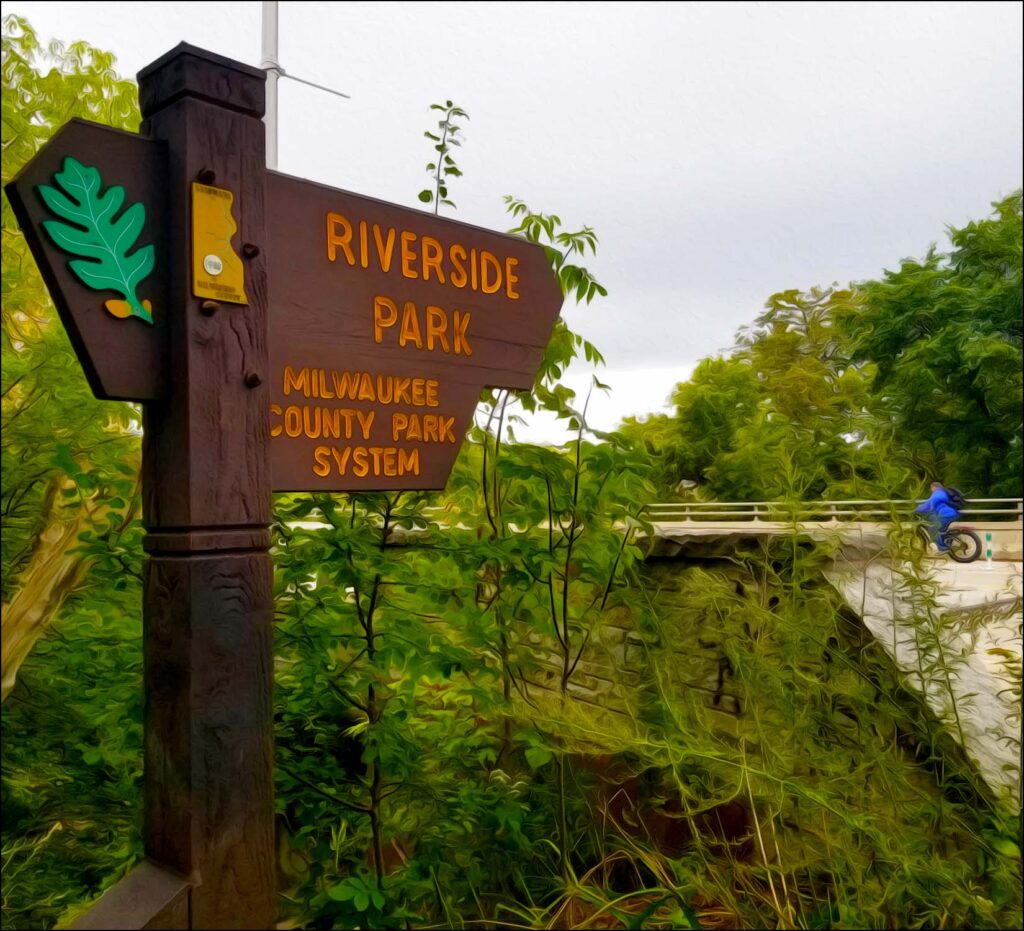 Picture of a Riverside Park sign. Riverside Park was once a large ravine sloping down from Locast Avenue to the eastern banks of the Milwaukee River.